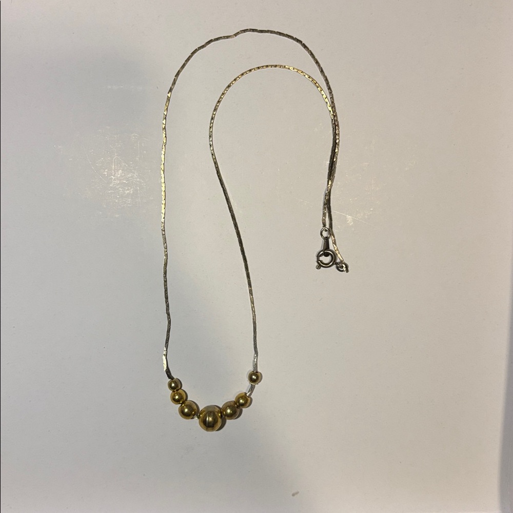 Elegant Gold and Silver Beaded Necklace